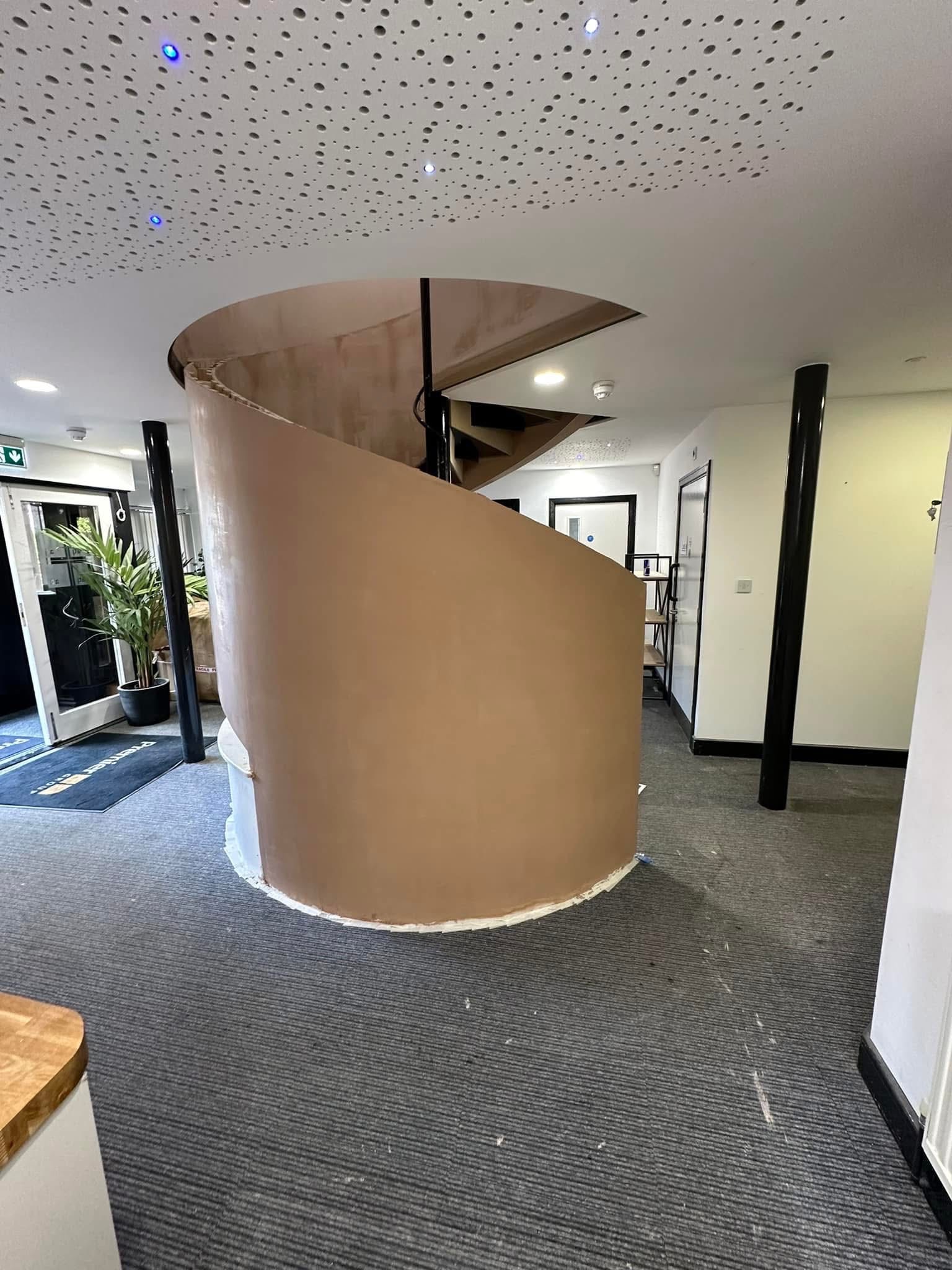 Curved staircase feature plastering